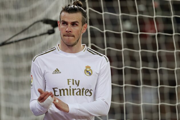 Real Madrid's Gareth Bale leaves the game during the Spanish La Liga soccer match between Real Madrid and Celta de Vigo at the Santiago Bernabeu stadium in Madrid, Spain, Sunday, Feb. 16, 2020. (AP Photo/Manu Fernandez)