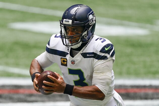 Seattle Seahawks quarterback Russell Wilson (3) works against the Atlanta Falcons during the first half of an NFL football game, Sunday, Sept. 13, 2020, in Atlanta. (AP Photo/John Bazemore)