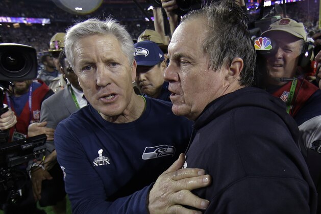 Seattle Seahawks head coach Pete Carroll, left, congratulates New England Patriots head coach Bill Belichick after NFL Super Bowl XLIX football game Sunday, Feb. 1, 2015, in Glendale, Ariz. The Patriots won 28-24. (AP Photo/Matt Slocum)