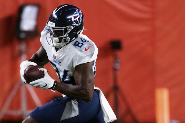 Tennessee Titans wide receiver Corey Davis (84) runs with the football against the Denver Broncos during the first half of an NFL football game, Monday, Sept. 14, 2020, in Denver. (AP Photo/Justin Edmonds)