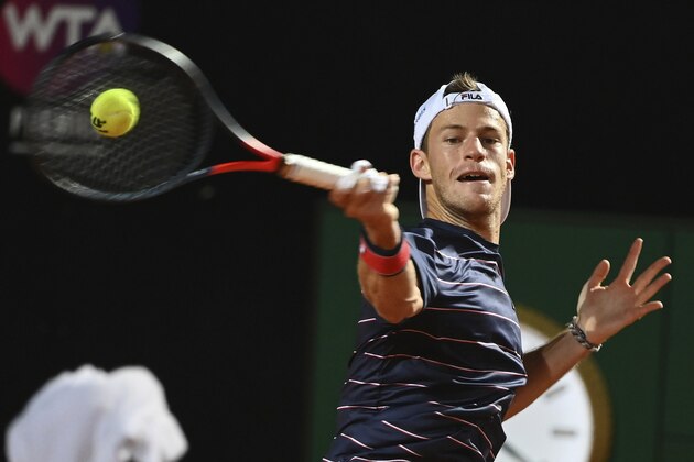 Argentina's Diego Schwartzman returns the ball to Spain's Rafael Nadal during their quarterfinals at the Italian Open tennis tournament, in Rome, Saturday, Sept. 19, 2020. (Alfredo Falcone/LaPresse via AP)
