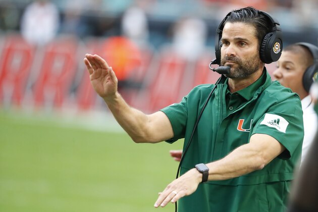 Miami head coach Manny Diaz calls out a play during the first half of an NCAA college football game against Louisville, Saturday, Nov. 9, 2019, in Miami Gardens, Fla. (AP Photo/Wilfredo Lee)