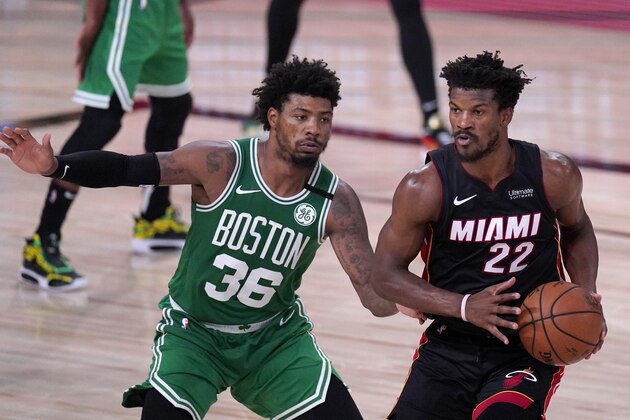 Boston Celtics' Marcus Smart (36) defends as Miami Heat's Jimmy Butler (22) looks to make a pass during the second half of an NBA conference final playoff basketball game, Saturday, Sept. 19, 2020, in Lake Buena Vista, Fla. (AP Photo/Mark J. Terrill)