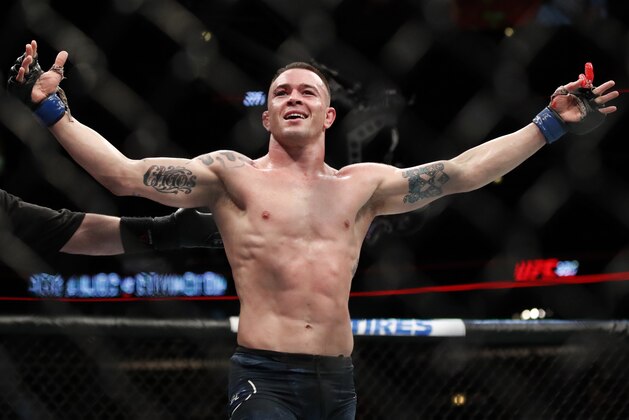 Colby Covington reacts after his win against Rafael Dos Anjos during their interim welterweight UFC 225 mixed martial arts bout Saturday, June 9, 2018, in Chicago. (AP Photo/Jim Young)