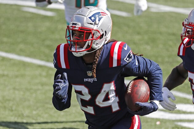 New England Patriots cornerback Stephon Gilmore runs back an interception against the Miami Dolphins during an NFL football game at Gillette Stadium, Sunday, Sept. 13, 2020 in Foxborough, Mass. (Winslow Townson/AP Images for Panini)
