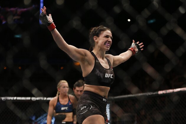Mackenzie Dern, from the United States, celebrates after defeating countrywoman Amanda Cooper during their UFC women's strawweight mixed martial arts bout in Rio de Janeiro, Brazil, early Sunday, May 13, 2018. (AP Photo/Leo Correa) Mackenzie Dern, from the United States, celebrates after defeating countrywoman Amanda Cooper during their UFC women's strawweight mixed martial arts bout in Rio de Janeiro, Brazil, early Sunday, May 13, 2018. (AP Photo/Leo Correa)