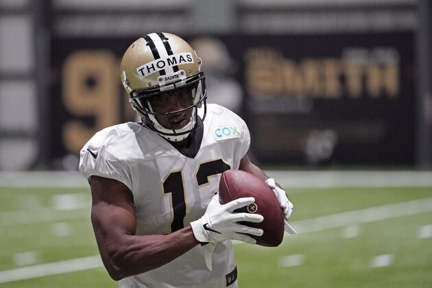 New Orleans Saints wide receiver Michael Thomas (13) goes through drills during practice at their NFL football training facility in Metairie, La., Monday, Aug. 24, 2020. (AP Photo/Gerald Herbert, Pool)