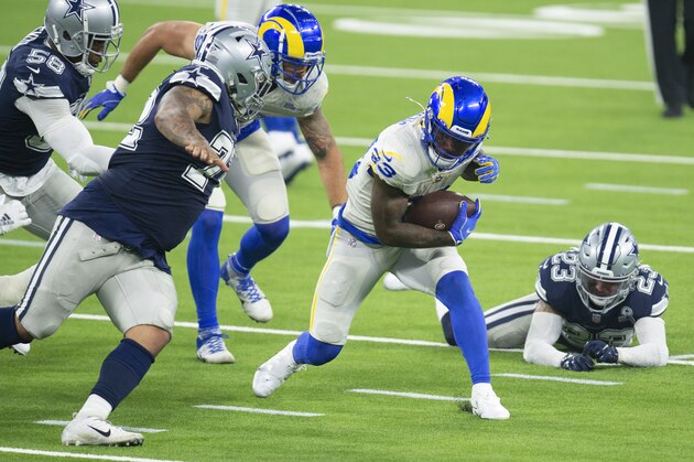 Los Angeles Rams running back Cam Akers, center, finds a hole during an NFL football game against the Dallas Cowboys, Sunday, Sept. 13, 2020, in Inglewood, Calif. (AP Photo/Kyusung Gong) Los Angeles Rams running back Cam Akers, center, finds a hole during an NFL football game against the Dallas Cowboys, Sunday, Sept. 13, 2020, in Inglewood, Calif. (AP Photo/Kyusung Gong)