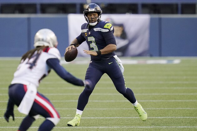 Seattle Seahawks quarterback Russell Wilson looks to pass against the New England Patriots during the first half of an NFL football game, Sunday, Sept. 20, 2020, in Seattle. (AP Photo/Elaine Thompson) Seattle Seahawks quarterback Russell Wilson looks to pass against the New England Patriots during the first half of an NFL football game, Sunday, Sept. 20, 2020, in Seattle. (AP Photo/Elaine Thompson)