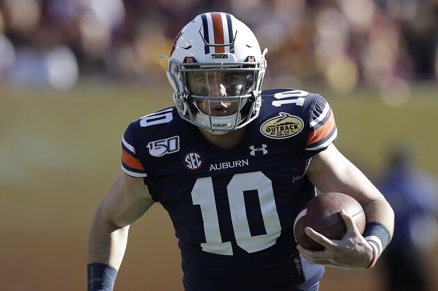 Auburn quarterback Bo Nix runs against Minnesota during the second half of the Outback Bowl NCAA college football game Wednesday, Jan. 1, 2020, in Tampa, Fla. (AP Photo/Chris O'Meara)
