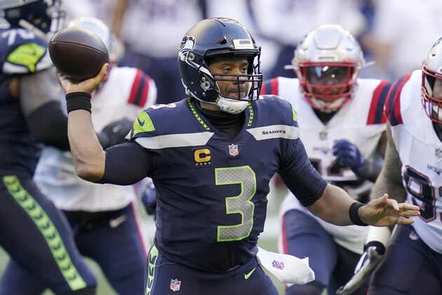 Seattle Seahawks quarterback Russell Wilson passes against the New England Patriots during the first half of an NFL football game, Sunday, Sept. 20, 2020, in Seattle. (AP Photo/Elaine Thompson)