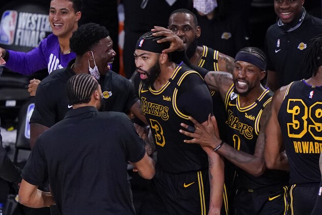 Los Angeles Lakers' Anthony Davis (3) celebrates with teammates after an NBA conference final playoff basketball game against the Denver Nuggets Sunday, Sept. 20, 2020, in Lake Buena Vista, Fla. The Lakers won 105-103. (AP Photo/Mark J. Terrill)