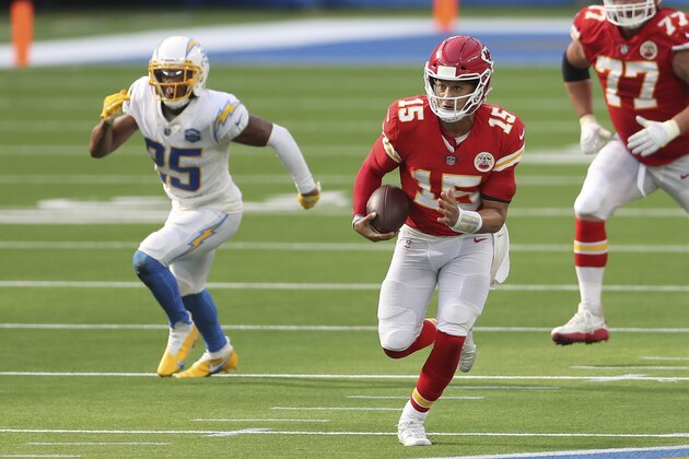 Kansas City Chiefs quarterback Patrick Mahomes (15) rushes on a keeper as Los Angeles Chargers cornerback Chris Harris (25) chases him from behind during an NFL football game between the between the Kansas City Chiefs and the Los Angeles Chargers, Sunday, Sept. 20, 2020, in Inglewood, Calif. (AP Photo/Peter Joneleit)