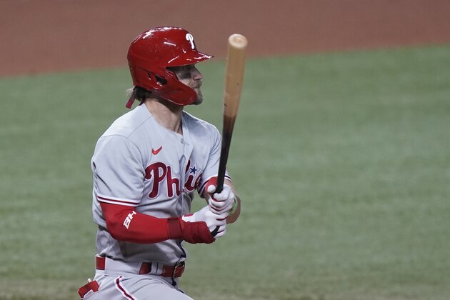 Philadelphia Phillies' Bryce Harper watches his double during the eighth inning of a baseball game against the Miami Marlins, Saturday, Sept. 12, 2020, in Miami. (AP Photo/Wilfredo Lee)
