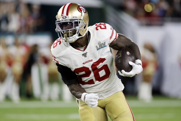 San Francisco 49ers' Tevin Coleman (26) runs against the Kansas City Chiefs during the first half of the NFL Super Bowl 54 football game Sunday, Feb. 2, 2020, in Miami Gardens, Fla. (AP Photo/Patrick Semansky)