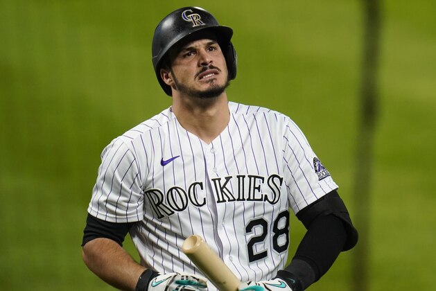 Colorado Rockies' Nolan Arenado reacts to striking out against the Oakland Athletics during the fourth inning of a baseball game Tuesday, Sept. 15, 2020, in Denver. (AP Photo/Jack Dempsey)