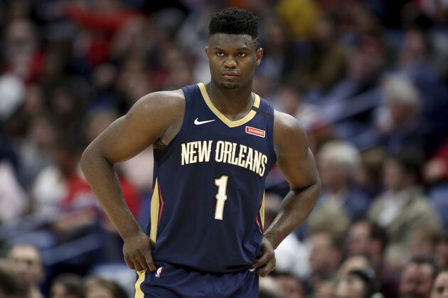 FILE - In this March 6, 2020, file photo, New Orleans Pelicans forward Zion Williamson walks onto the court during the second half of the team's NBA basketball game against the Miami Heat in New Orleans. A Florida appeals court has granted Williamson’s motion to block his former marketing agent’s effort to have the ex-Duke star answer questions about whether he received improper benefits before playing for the Blue Devils. The order Wednesday shifts the focus to separate but related case between the same litigants in federal court in North Carolina. (AP Photo/Rusty Costanza, File)
