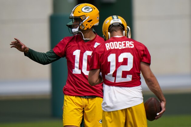 Green Bay Packers' Aaron Rodgers and Jordan Love run a drill during NFL football training camp Saturday, Aug. 15, 2020, in Green Bay, Wis. (AP Photo/Morry Gash)