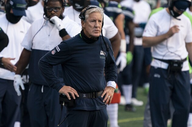 Seattle Seahawks head coach Pete Carroll watches play from the sidelines during the first half an NFL football game against the New England Patriots, Sunday, Sept. 20, 2020, in Seattle. The Seahawks won 35-30. (AP Photo/Stephen Brashear)