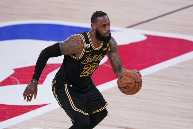 Los Angeles Lakers' LeBron James (23) drives up court during the second half of an NBA conference final playoff basketball game against the Denver Nuggets Sunday, Sept. 20, 2020, in Lake Buena Vista, Fla. (AP Photo/Mark J. Terrill)