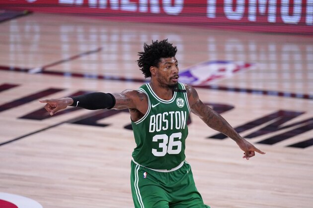 Boston Celtics' Marcus Smart (36) gestures to teammates during the second half of an NBA conference final playoff basketball game against the Miami Heat on Saturday, Sept. 19, 2020, in Lake Buena Vista, Fla. (AP Photo/Mark J. Terrill)