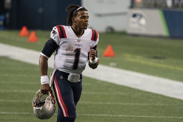 New England Patriots quarterback Cam Newton jogs off the field after an NFL football game against the Seattle Seahawks, Sunday, Sept. 20, 2020, in Seattle. The Seahawks won 35-30. (AP Photo/Stephen Brashear)