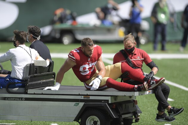 San Francisco 49ers defensive end Nick Bosa (97) is driven off the field after being injured during the first half of an NFL football game against the New York Jets Sunday, Sept. 20, 2020, in East Rutherford, N.J. (AP Photo/Bill Kostroun)