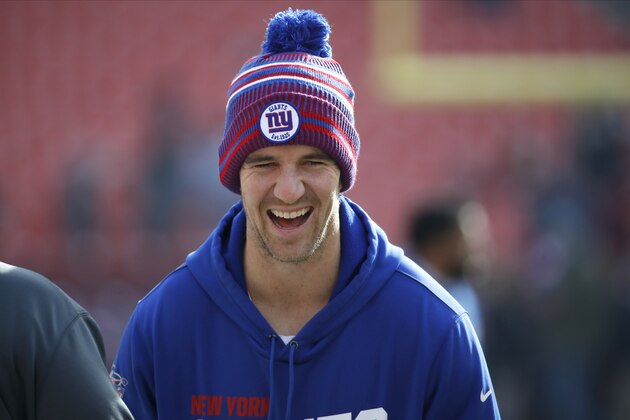 New York Giants quarterback Eli Manning reacts while talking to a member of the Washington Redskins prior to an NFL football game, Sunday, Dec. 22, 2019, in Landover, Md. (AP Photo/Alex Brandon)