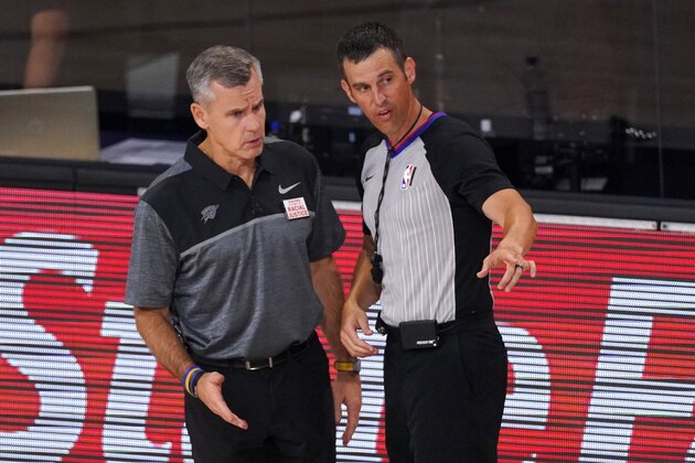 Oklahoma City Thunder head coach Billy Donovan, left, talks with an official during the second half of an NBA first-round playoff basketball game against the Houston Rockets on Monday, Aug. 31, 2020, in Lake Buena Vista, Fla. (AP Photo/Mark J. Terrill)