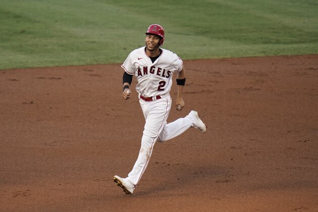 Los Angeles Angels' Andrelton Simmons rounds the bases after a home run by Mike Trout during the first inning of a baseball game against the Houston Astros, Friday, Sept. 4, 2020, in Anaheim, Calif. (AP Photo/Jae C. Hong)