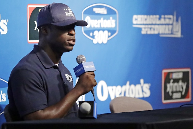 Jesse Iwuji speaks at a news conference for the NASCAR Cup series auto race at Chicagoland Speedway in Joliet, Ill., Friday, June. 29, 2018. (AP Photo/Nam Y. Huh)