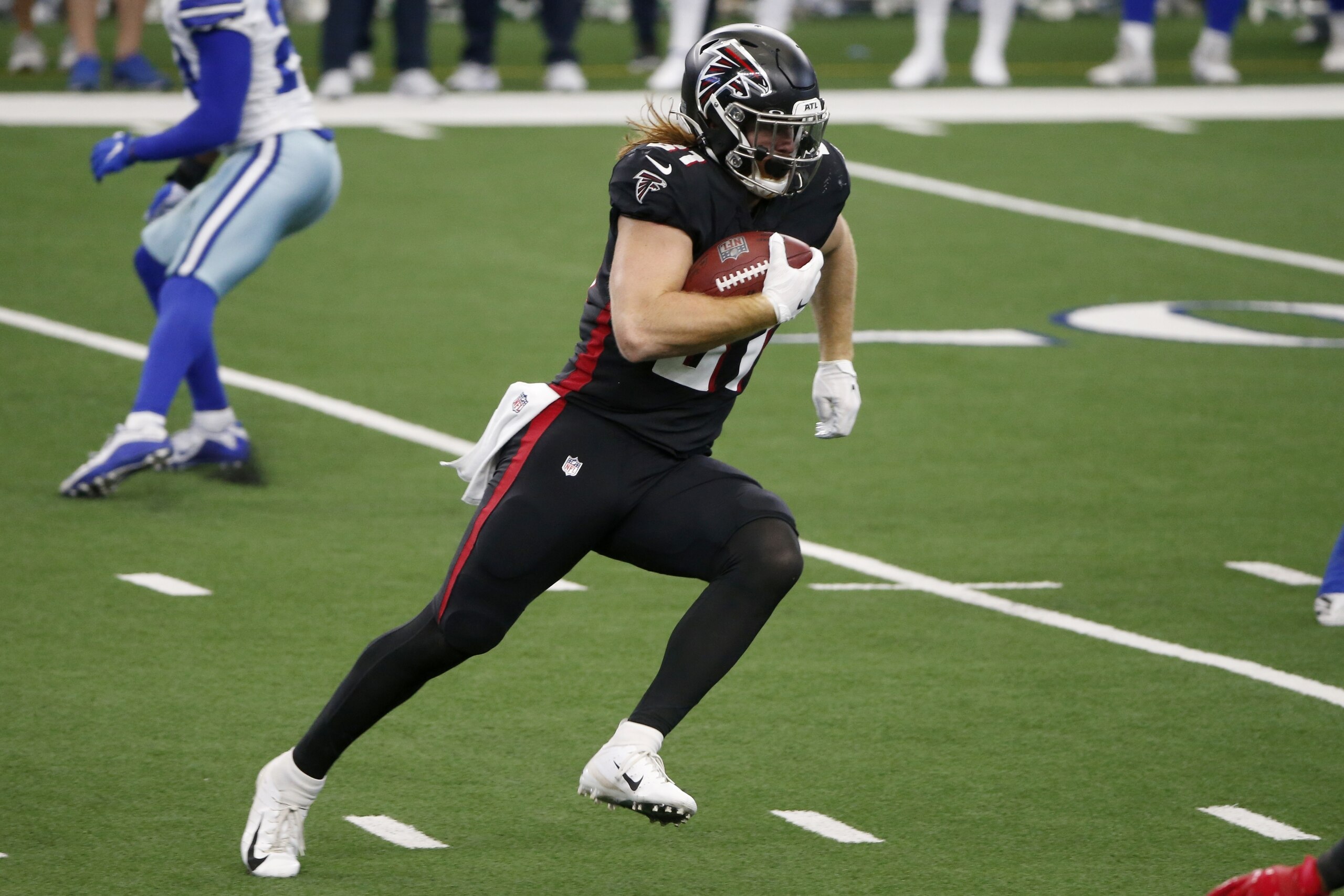 Atlanta Falcons tight end Hayden Hurst (81) gains long yardage after catching a pass in the second half of an NFL football game against the Dallas Cowboys in Arlington, Texas, Sunday, Sept. 20, 2020. (AP Photo/Michael Ainsworth)
