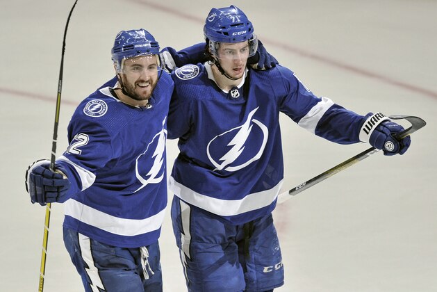 Tampa Bay Lightning's Kevin Shattenkirk, left, and Anthony Cirelli celebrate Cirelli's goal against the St. Louis Blues during the second period of an NHL hockey game Wednesday, Nov. 27, 2019, in Tampa, Fla. (AP Photo/Steve Nesius)