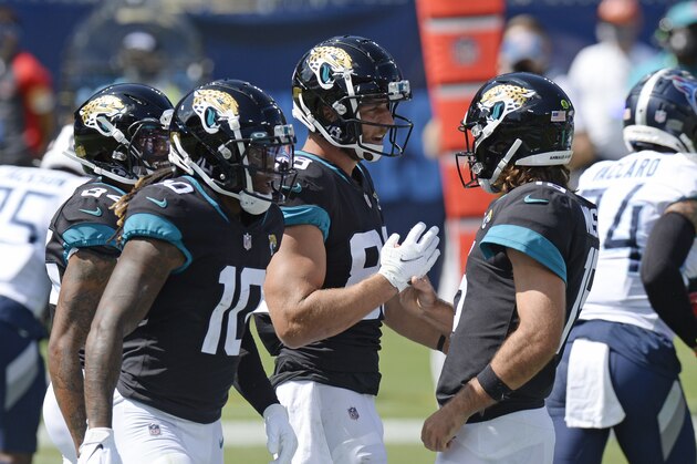 Jacksonville Jaguars tight end Tyler Eifert (88) is congratulated by quarterback Gardner Minshew, right, after teaming up for a 19-yard touchdown pass against the Tennessee Titans in the first half of an NFL football game Sunday, Sept. 20, 2020, in Nashville, Tenn. (AP Photo/Mark Zaleski)