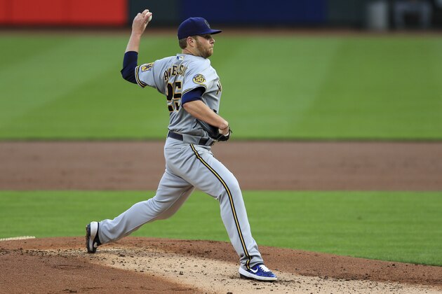 Milwaukee Brewers' Brett Anderson throws in the first inning during a baseball game against the Cincinnati Reds in Cincinnati, Tuesday, Sept. 22, 2020. (AP Photo/Aaron Doster)