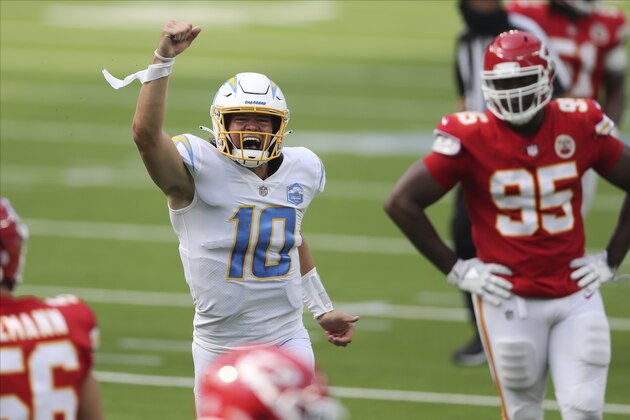 Los Angeles Chargers quarterback Justin Herbert (10) celebrates after his first career NFL touchdown pass during an NFL football game between against the Kansas City Chiefs, Sunday, Sept. 20, 2020, in Inglewood, Calif. (AP Photo/Peter Joneleit)