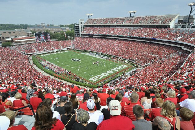 FILE - In this Sept. 5, 2015, file photo, Georgia fans watch the season opening NCAA college football game against Louisiana Monroe at Sanford Stadium n Athens, Ga. The Georgia Bulldog are planning to have fans between the hedges. The school announced ticket plans that call for allowing 20-25% capacity at 92,746-seat Sanford Stadium.  (AP Photo/John Amis, File)