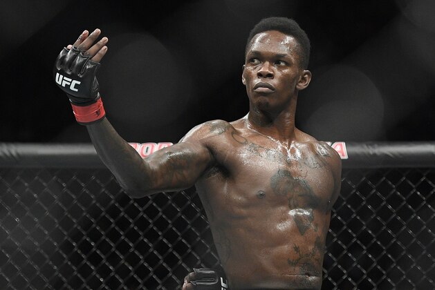 Nigeria's Israel Adesanya poses as he fights Brazil's Anderson Silva in their middleweight bout at the UFC 234 event in Melbourne, Australia, Sunday, Feb. 10, 2019. (AP Photo/Andy Brownbill)