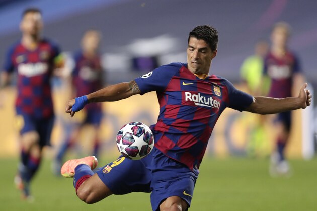 Barcelona's Luis Suarez kicks the ball during the Champions League quarterfinal match between FC Barcelona and Bayern Munich at the Luz stadium in Lisbon, Portugal, Friday, Aug. 14, 2020. (AP Photo/Manu Fernandez/Pool)