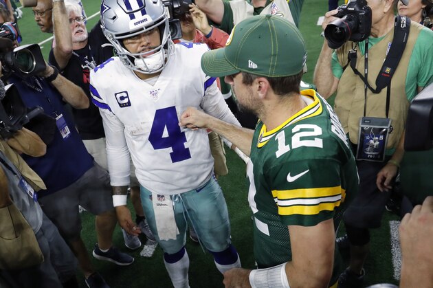 Dallas Cowboys' Dak Prescott (4) and Green Bay Packers' Aaron Rodgers (12) greet each other after their NFL football game in Arlington, Texas, Sunday, Oct. 6, 2019. (AP Photo/Roger Steinman)