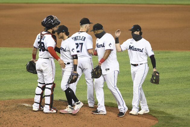 Miami Marlins celebrate after the team's baseball game against the Washington Nationals,Sunday, Sept. 20, 2020, in Miami. The Marlins won 2-1. (AP Photo/Gaston De Cardenas) Miami Marlins celebrate after the team's baseball game against the Washington Nationals,Sunday, Sept. 20, 2020, in Miami. The Marlins won 2-1. (AP Photo/Gaston De Cardenas)