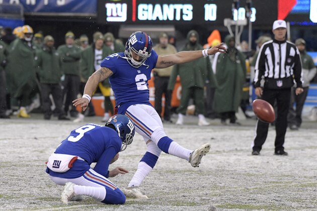 New York Giants kicker Aldrick Rosas (2) kicks a field goal as Riley Dixon (9) holds during the second half of an NFL football game against the Green Bay Packers, Sunday, Dec. 1, 2019, in East Rutherford, N.J. (AP Photo/Bill Kostroun)