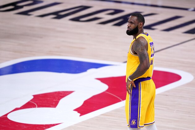 Los Angeles Lakers forward LeBron James stands on the court during the second half an NBA conference final playoff basketball game against the Denver Nuggets on Friday, Sept. 18, 2020, in Lake Buena Vista, Fla. (AP Photo/Mark J. Terrill) Los Angeles Lakers forward LeBron James stands on the court during the second half an NBA conference final playoff basketball game against the Denver Nuggets on Friday, Sept. 18, 2020, in Lake Buena Vista, Fla. (AP Photo/Mark J. Terrill)