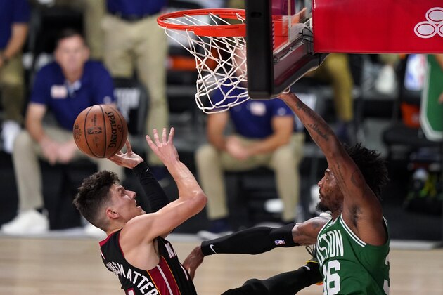 Miami Heat guard Tyler Herro (14) takes a shot as Boston Celtics' Marcus Smart, right, defends during the first half of Game 4 of an NBA basketball Eastern Conference final, Wednesday, Sept. 23, 2020, in Lake Buena Vista, Fla. (AP Photo/Mark J. Terrill) Miami Heat guard Tyler Herro (14) takes a shot as Boston Celtics' Marcus Smart, right, defends during the first half of Game 4 of an NBA basketball Eastern Conference final, Wednesday, Sept. 23, 2020, in Lake Buena Vista, Fla. (AP Photo/Mark J. Terrill)
