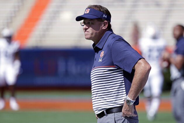 Auburn head coach Gus Malzahn watches his team warm up before an NCAA college football game against Florida, Saturday, Oct. 5, 2019, in Gainesville, Fla. (AP Photo/John Raoux)