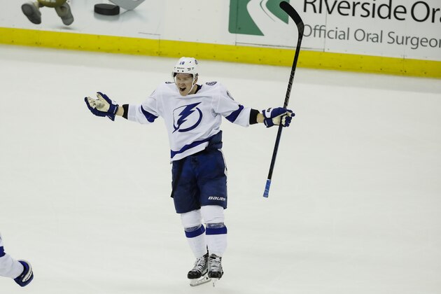 Tampa Bay Lightning left wing Ondrej Palat (18) celebrates after scoring during the third period of the team's NHL hockey game against the New Jersey Devils on Wednesday, Oct. 30, 2019, in Newark, N.J. The Lightning won 7-6 in overtime. (AP Photo/Frank Franklin II)