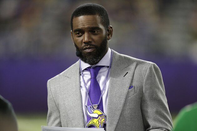 ESPN Monday Night Countdown personality Randy Moss stands on the field before an NFL football game between the Minnesota Vikings and the Green Bay Packers, Monday, Dec. 23, 2019, in Minneapolis. (AP Photo/Andy Clayton-King)