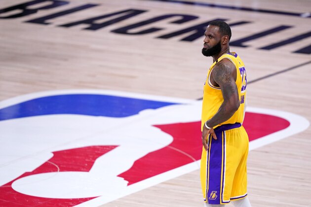 Los Angeles Lakers forward LeBron James stands on the court during the second half an NBA conference final playoff basketball game against the Denver Nuggets on Friday, Sept. 18, 2020, in Lake Buena Vista, Fla. (AP Photo/Mark J. Terrill)
