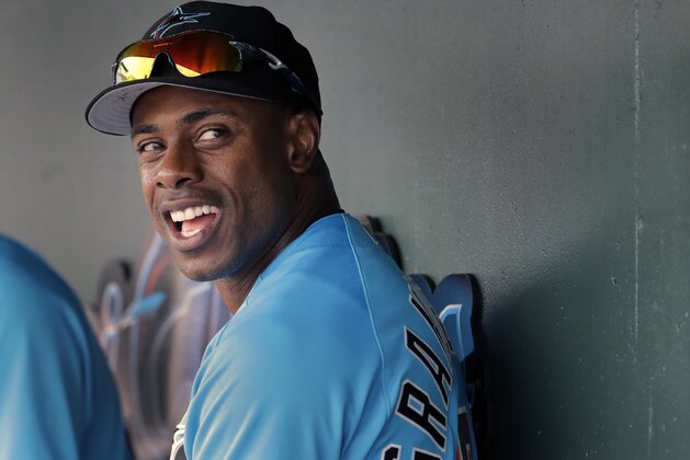Miami Marlins' Curtis Granderson is seen in the dugout during an exhibition spring training baseball game against the Washington Nationals Friday, March 1, 2019, in Jupiter, Fla. (AP Photo/Jeff Roberson)
