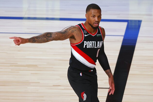 Portland Trail Blazers' Damian Lillard reacts during the first half of an NBA basketball game against the Houston Rockets Tuesday, Aug. 4, 2020, in Lake Buena Vista, Fla. (Kevin C. Cox/Pool Photo via AP) Portland Trail Blazers' Damian Lillard reacts during the first half of an NBA basketball game against the Houston Rockets Tuesday, Aug. 4, 2020, in Lake Buena Vista, Fla. (Kevin C. Cox/Pool Photo via AP)